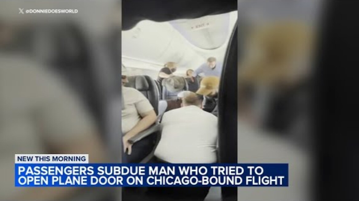 Man duct-taped on flight to Chicago after trying to open door, passengers say